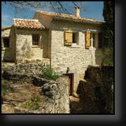 Several century old stone building in the hills of Luberon